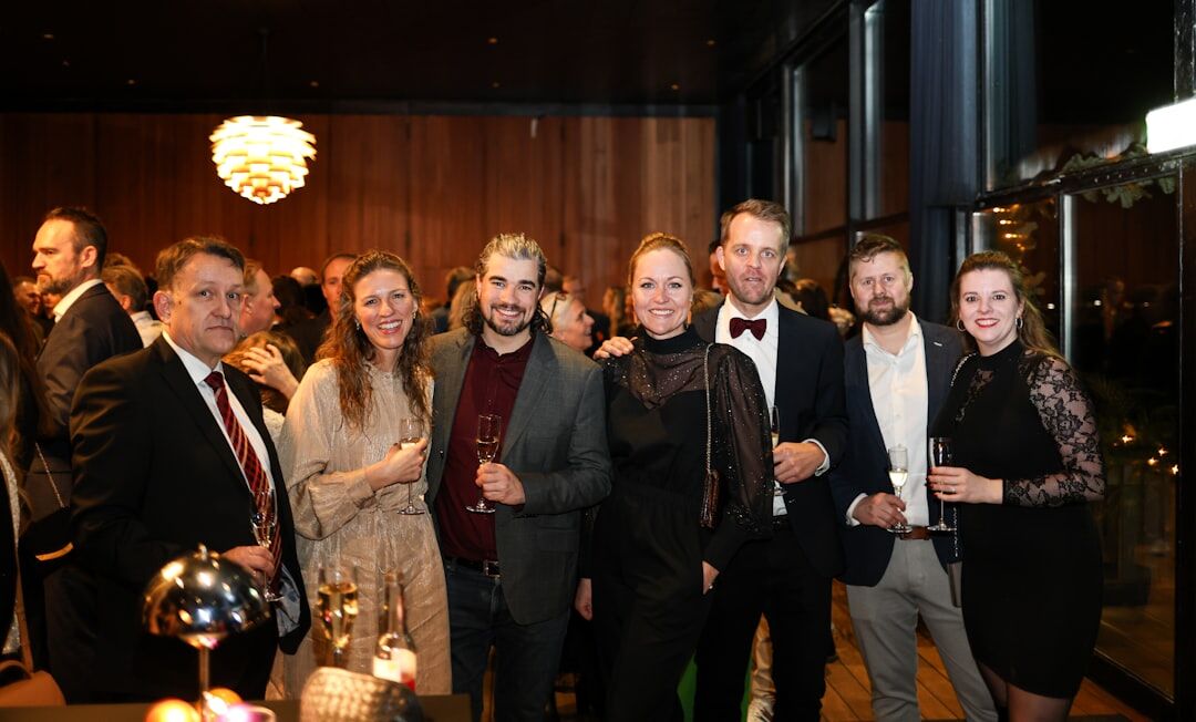 Small group of professionals chatting at a cocktail networking event