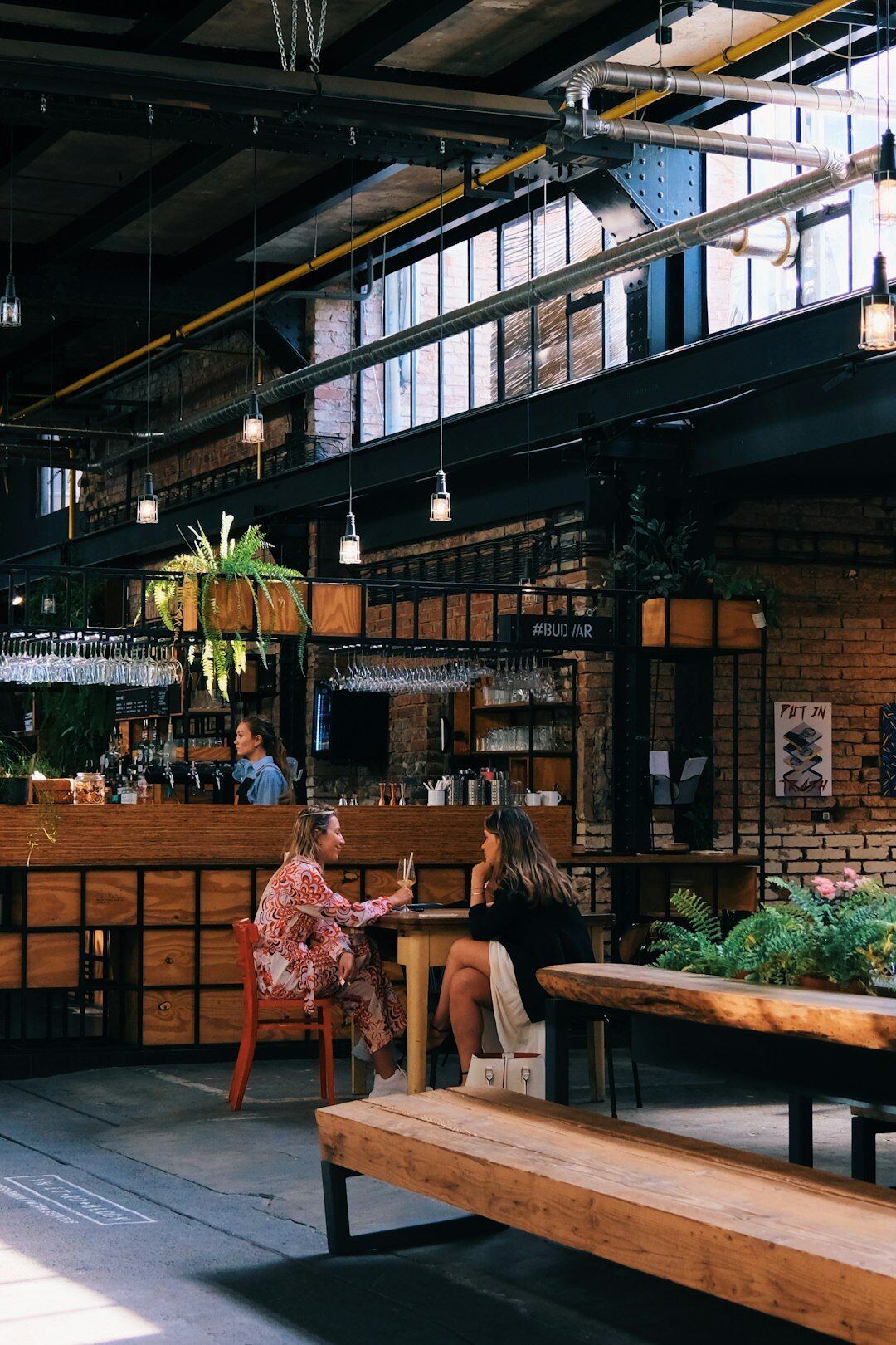 Group of entrepreneurs meeting around a table in a modern coworking space