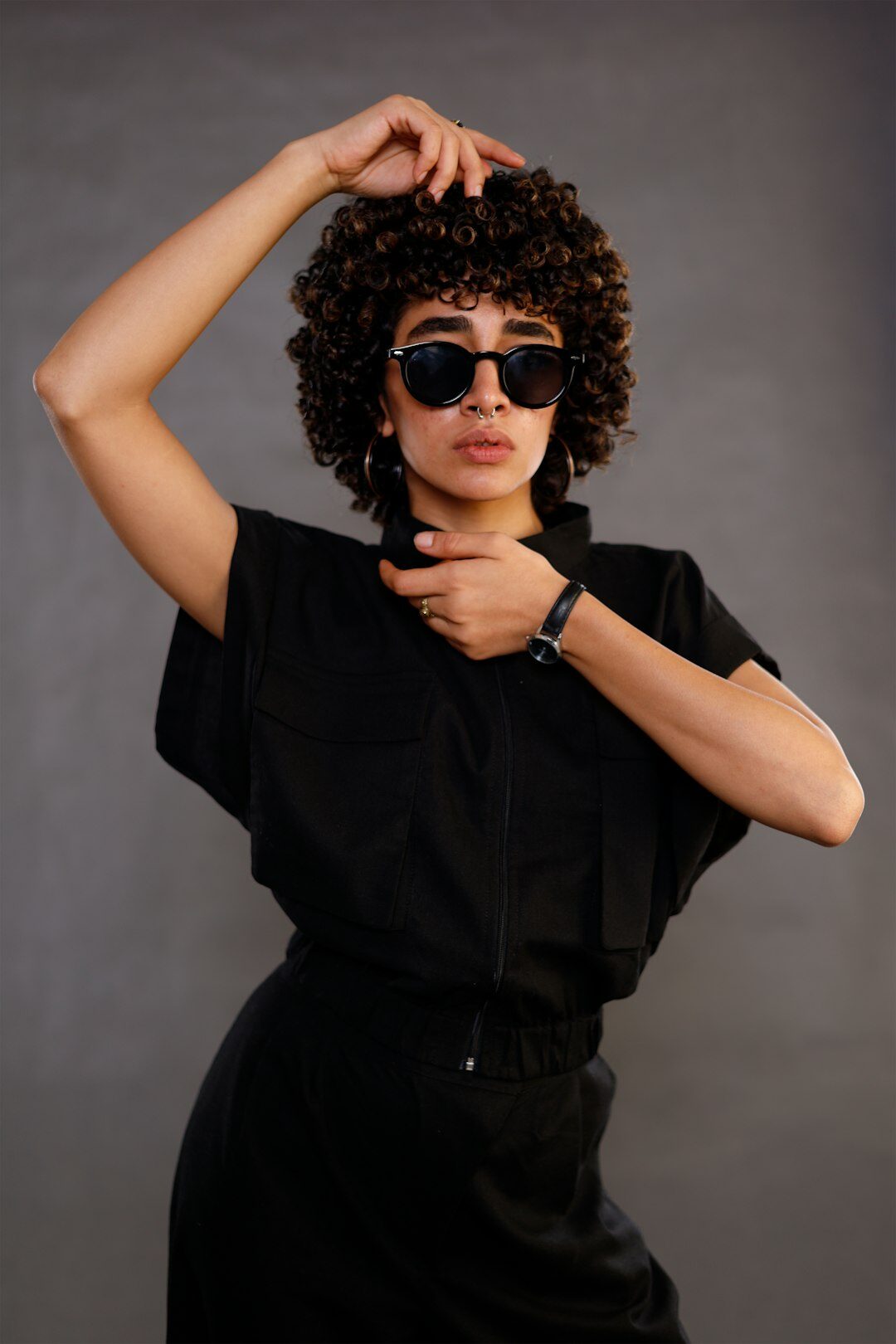 Studio portrait of a young professional woman with curly hair